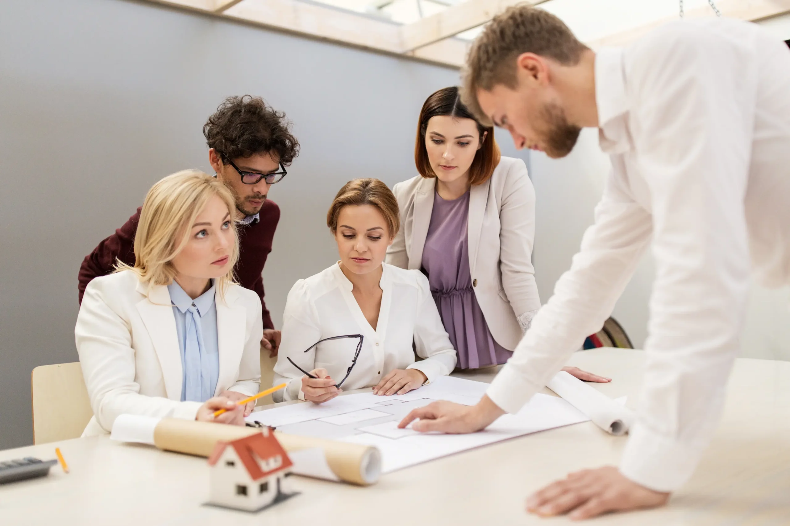 business team discussing house project at office 2024 09 27 23 22 46 utc 2 scaled