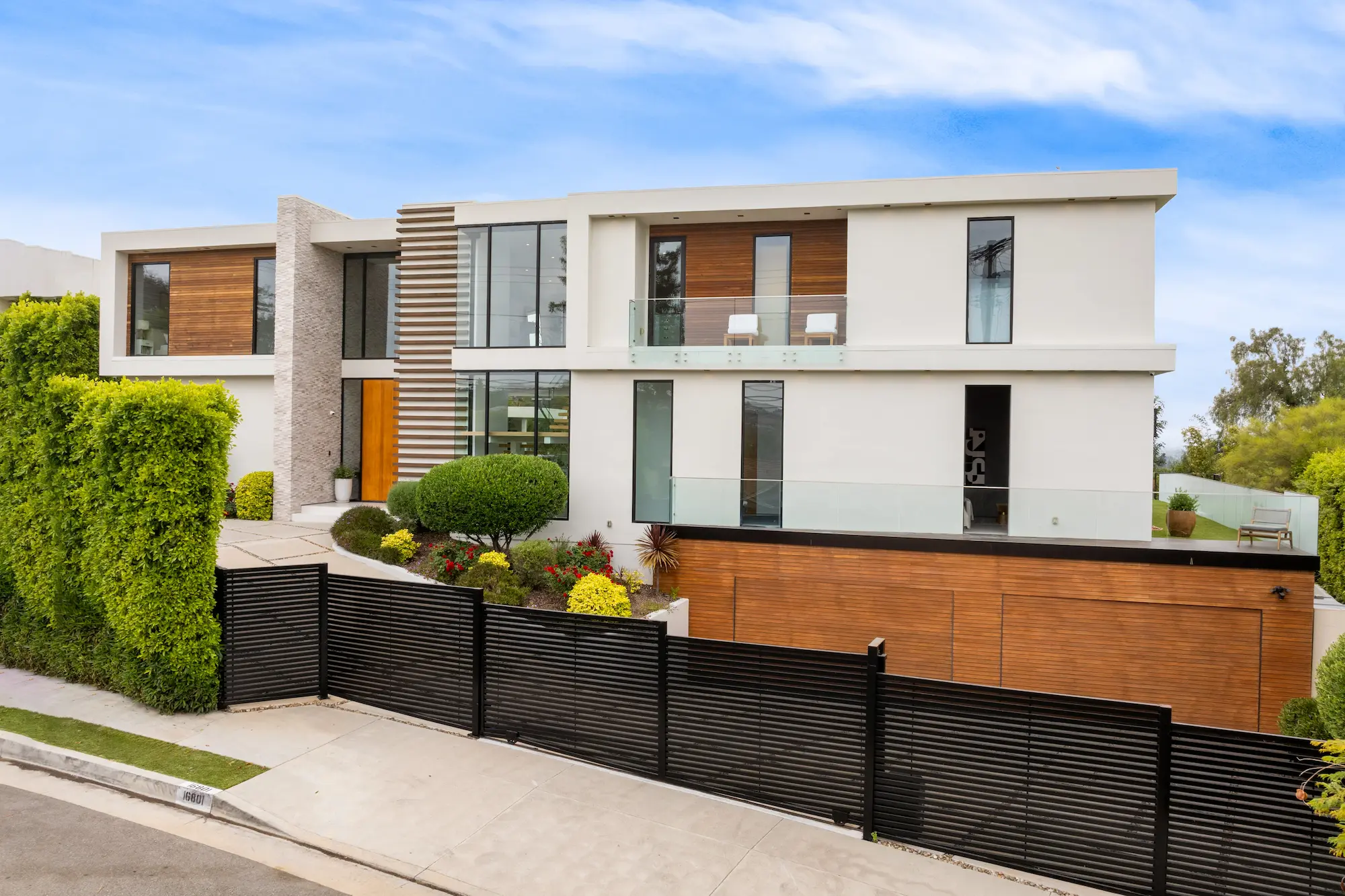 contemporary house on a corner lot with lush folia 2025 02 03 05 35 26 utc 1