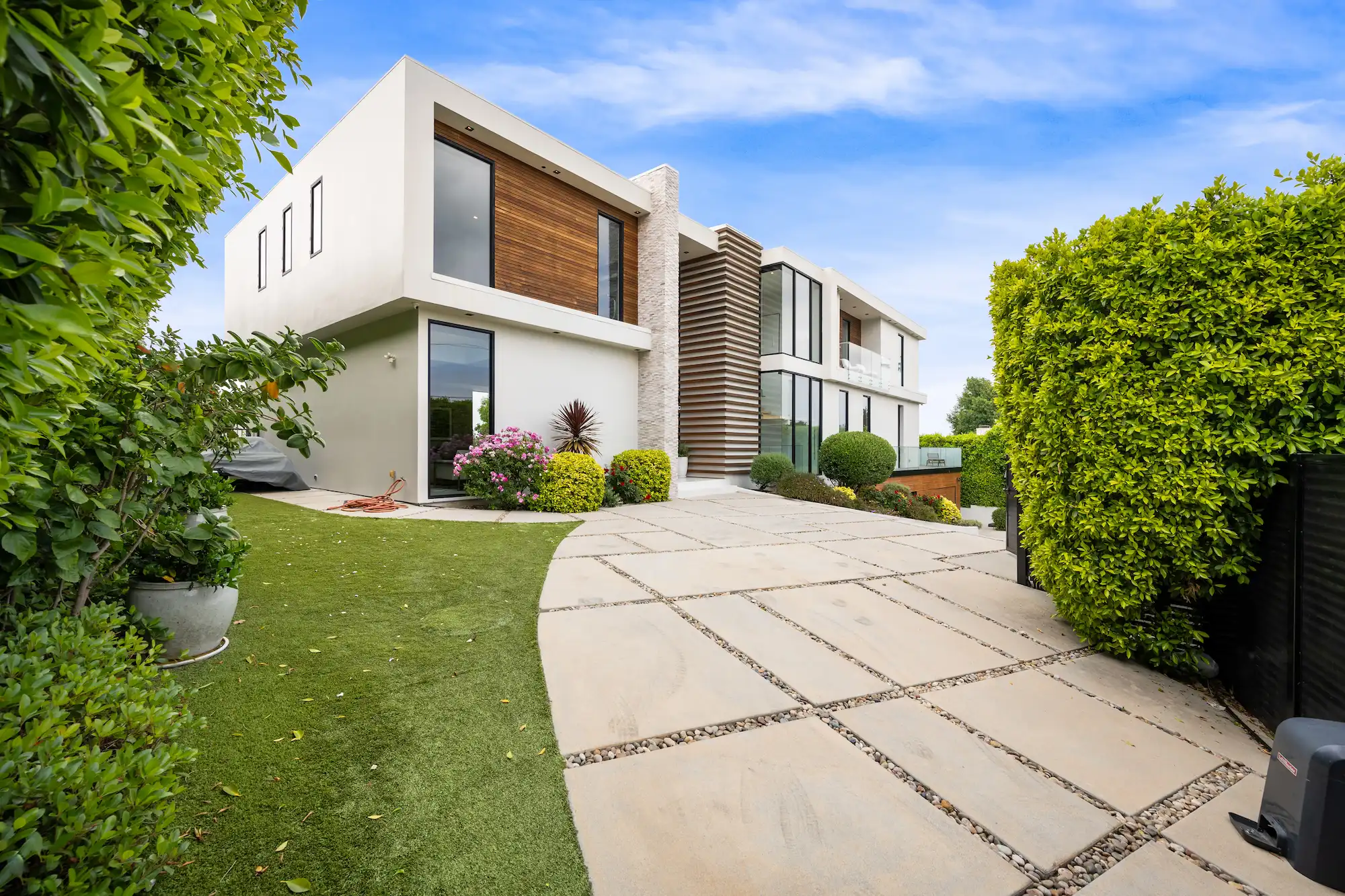 driveway of a contemporary house with a garden are 2025 02 11 18 47 12 utc 1
